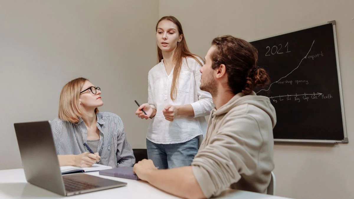 A small growth team discussing organic traffic plans around a conference table