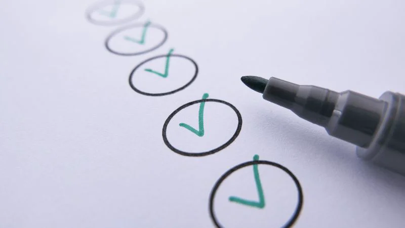 Editor reviewing an automated content publishing quality checklist before an article goes live