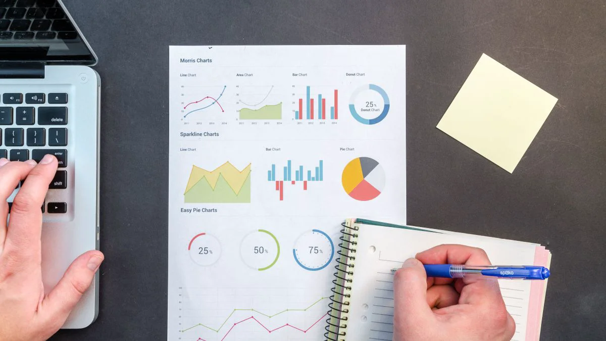 A laptop showing workflow steps and performance metrics for an SEO automation calculator
