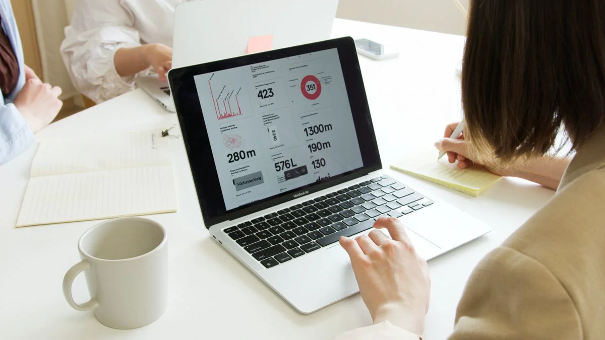 Marketer reviewing search performance data on a laptop