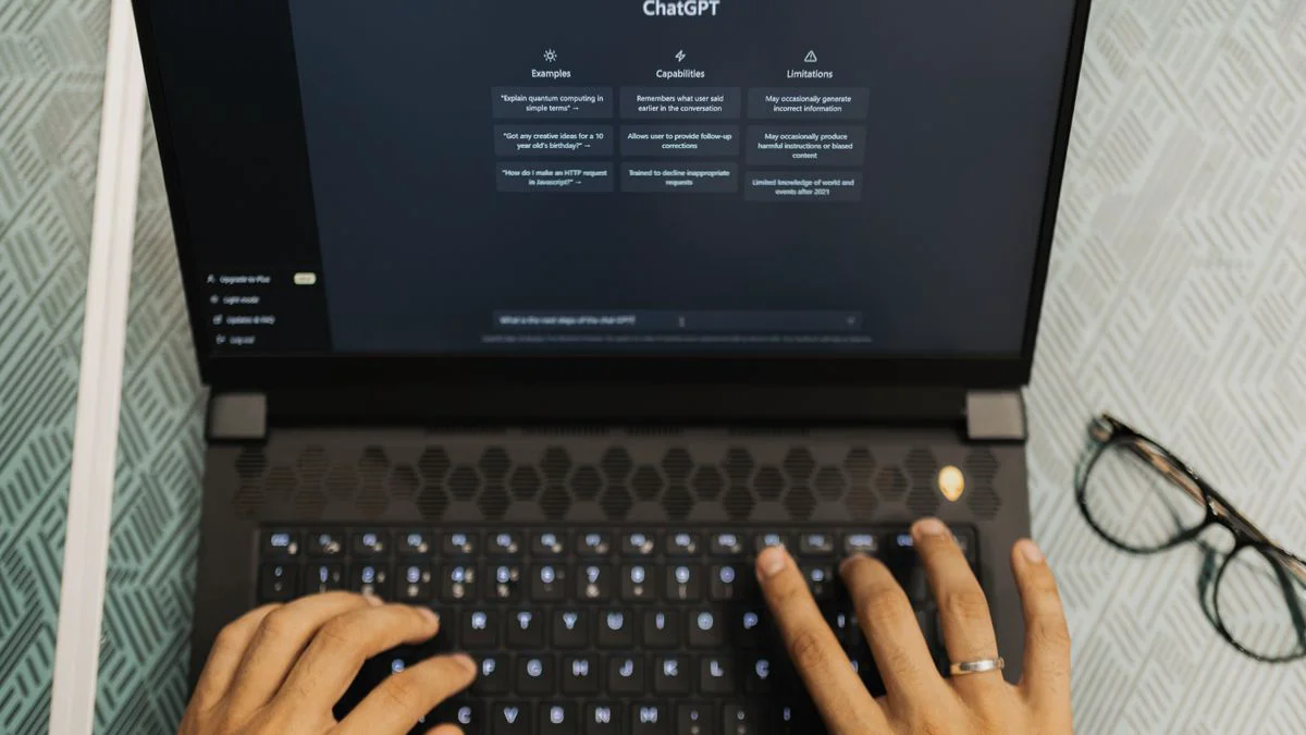 Person reviewing AI-generated search results on a laptop at a desk