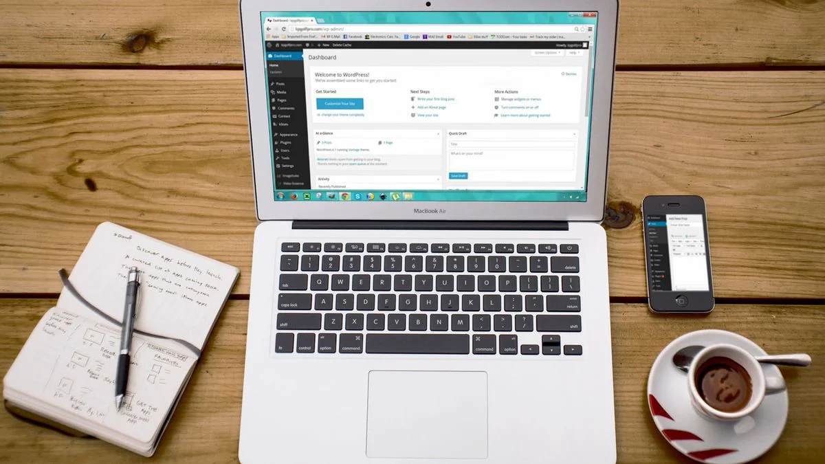 A content team working on a website publishing workflow with laptops and planning notes