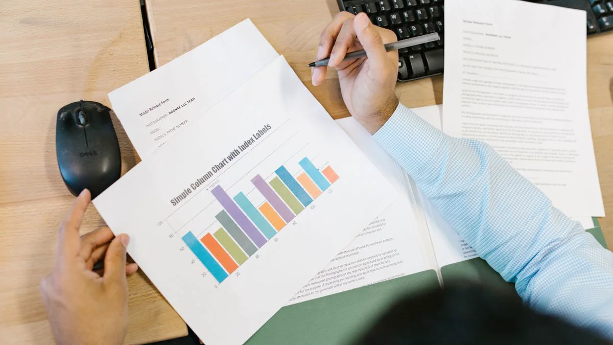 Analyst reviewing spreadsheet rows on a laptop screen