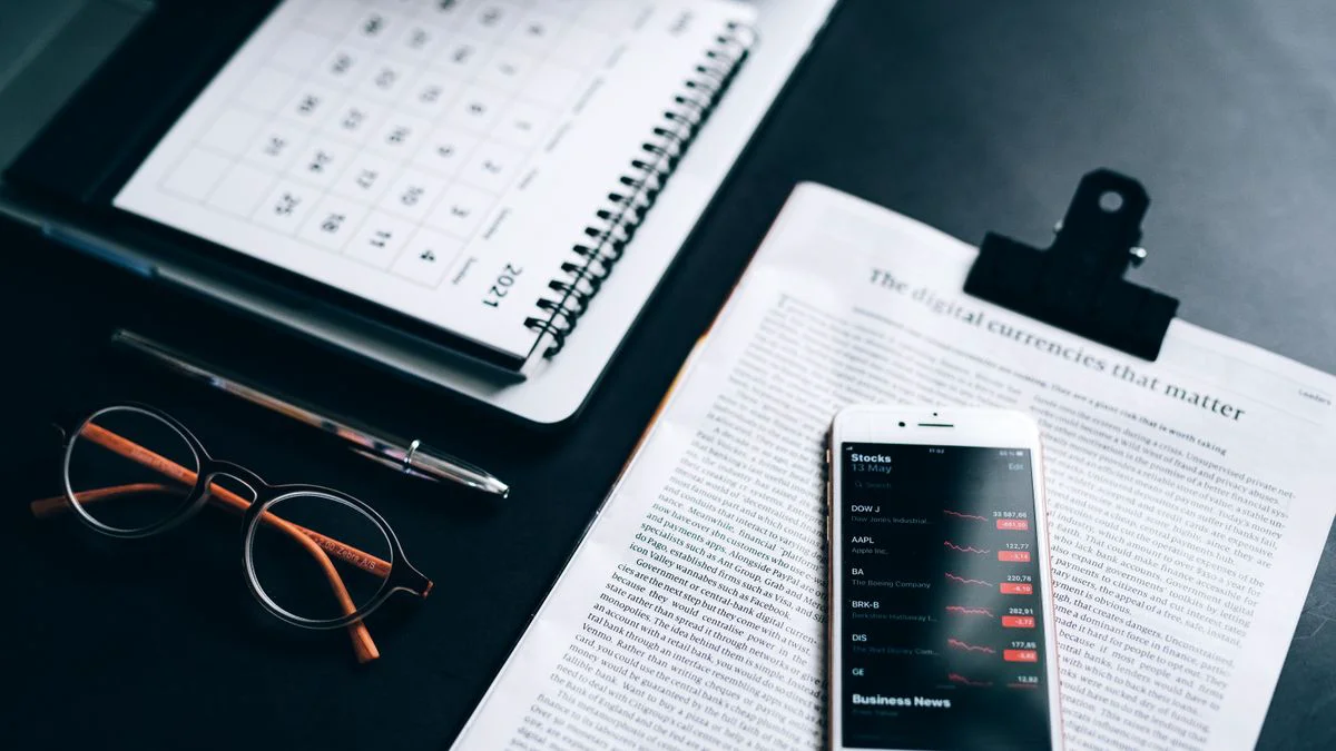 A marketer looks at a content calendar and website performance charts on a screen