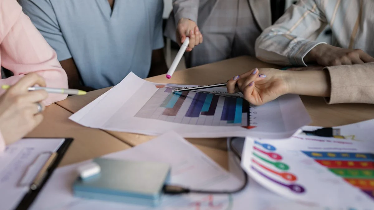 Team planning content and visibility tasks around a meeting table