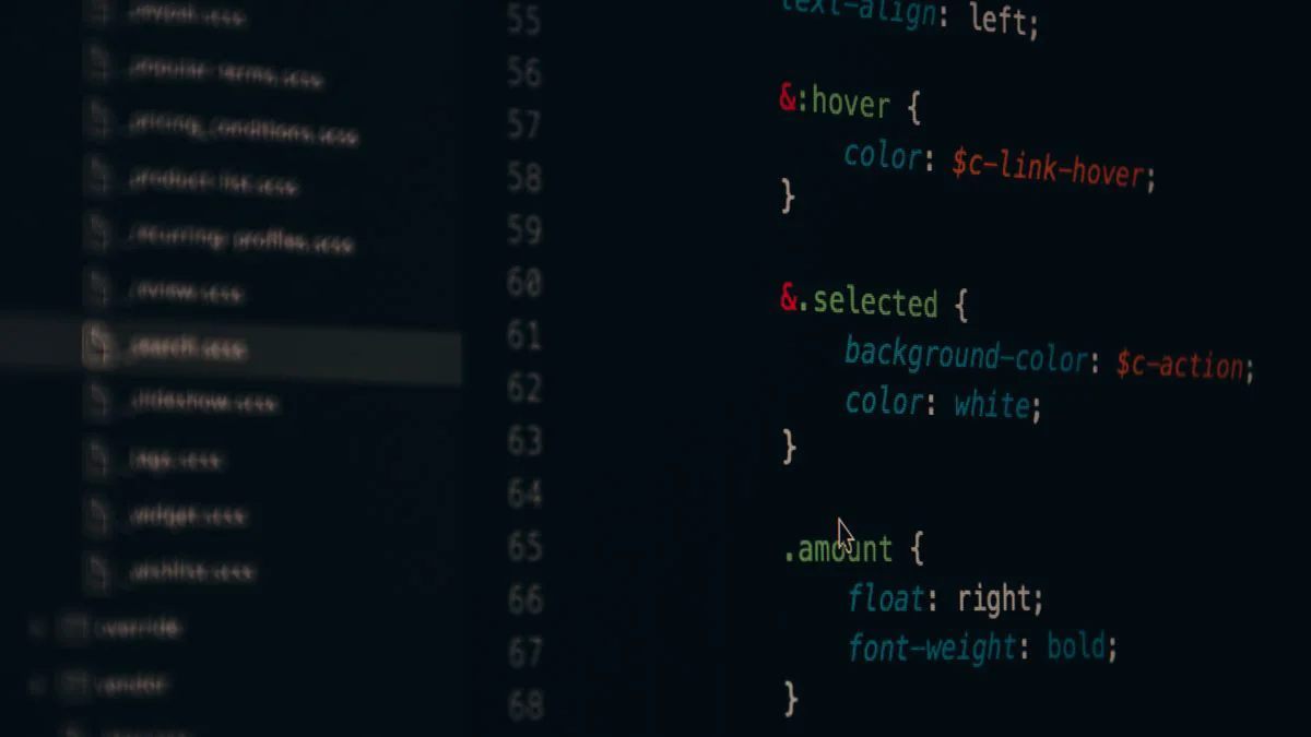 Developer reviewing website code and crawl settings on a desktop monitor